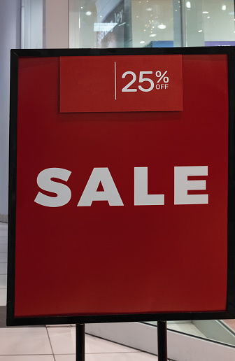 25 percent off in white letters on a red background. Business concept, the text is written - 25 percent OFF SALE. Nobody, selective focus