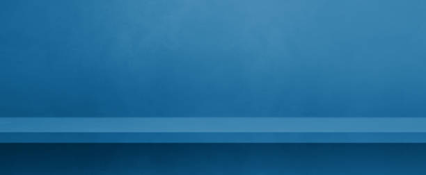 istock Empty shelf on a blue concrete wall. Background template. Horizontal banner mockup 1480490245