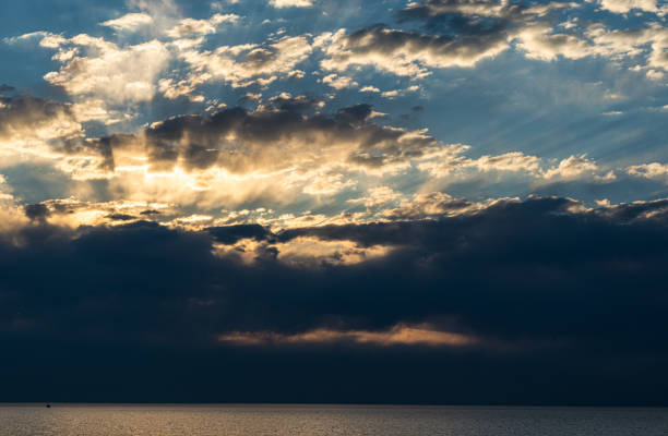 Dramatic sunset on the beach of Batumi seashore of Black sea