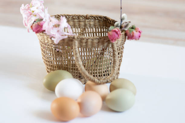 istock still life with simple chicken eggs, soft pastel colors, natural color chicken eggs, eggs in a wicker basket, Easter concept 1480498313