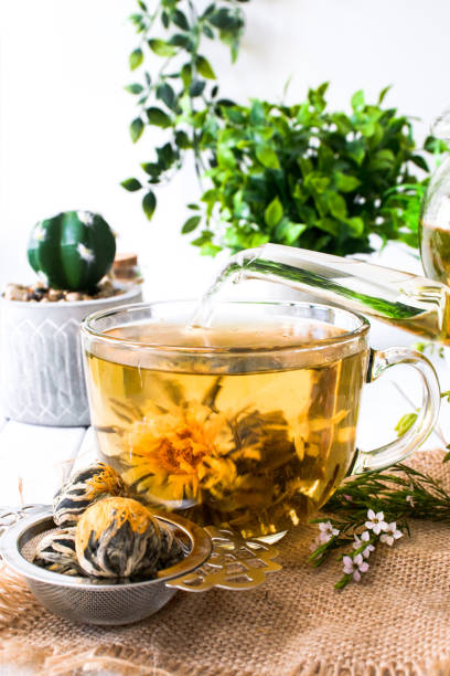 istock Blooming flower tea in a glass cup 1480499776