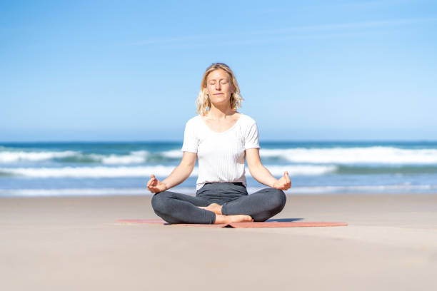 istock Yogi woman practicing yoga meditating with eyes closed 1480500049