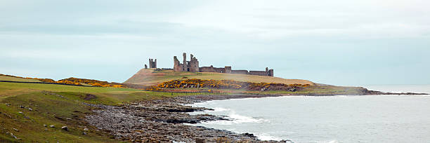 istock Panorama of Dunstanburgh castle 148050062