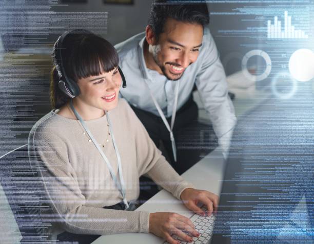 istock Woman, man and night by computer with overlay, smile and coaching for tech support, data analytics or web. Teamwork, learning and crm training with 3d holographic for collaboration, typing and job 1480501117