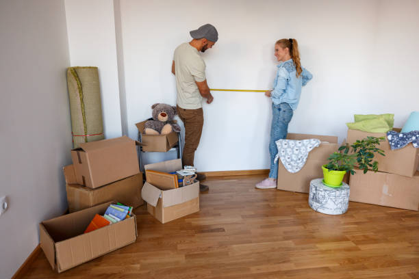 istock Couple using tape measure in their new apartment 1480501324