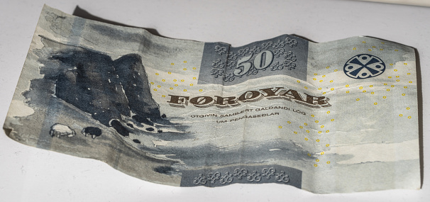 Crumbled 50 Kroner banknote from  the Faroe Islands. The Faroe Islands is an autonomous part of the Kingdom of Denmark