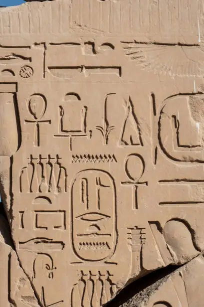 Ancient Egyptian stone cartouche hieroglyphic relief detail at Karnak Temple, Luxor. Egypt.