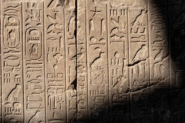 Ancient Egyptian stone cartouche hieroglyphic relief detail at Karnak Temple, Luxor. Egypt.
