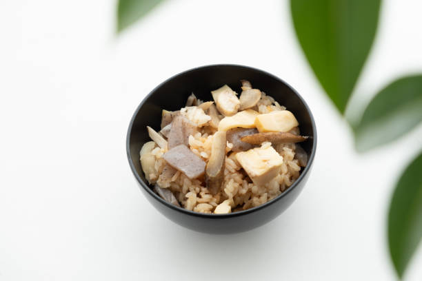 istock japanese food Rice cooked with bamboo shoots on the table 1480508942