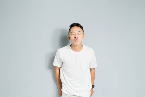 a young Asian is about to kiss