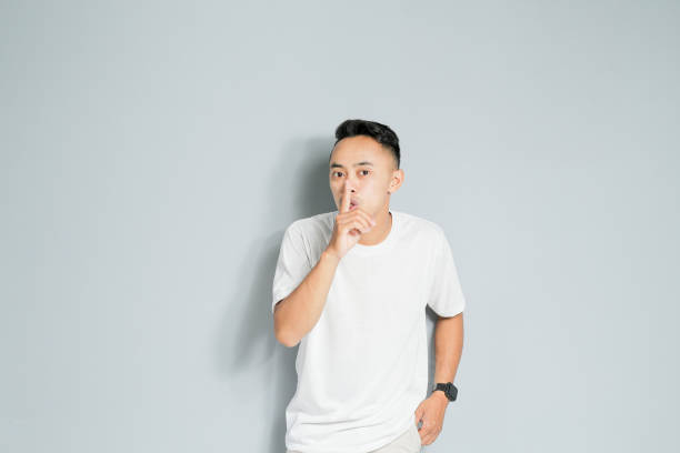 istock an Asian youth is making a silent gesture 1480512766