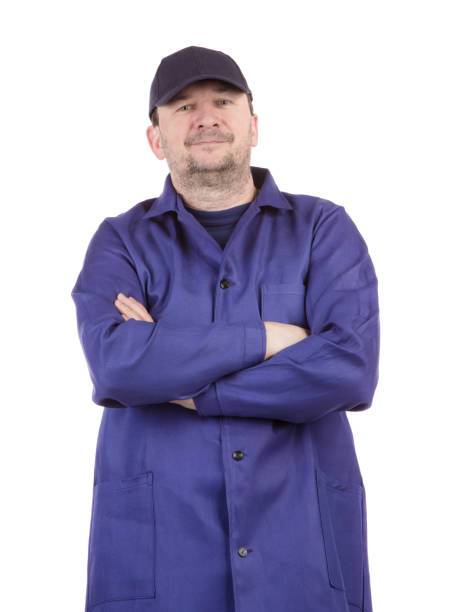 istock A worker in a blue lab coat with his arms crossed on his chest. 1480514251