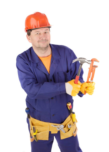 istock A worker in a protective helmet holds a hammer in his hand. 1480514351