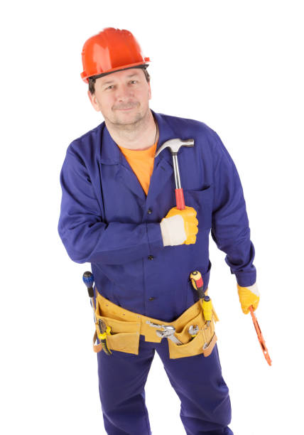 istock A worker in a protective helmet holds a hammer in his hand. 1480514372
