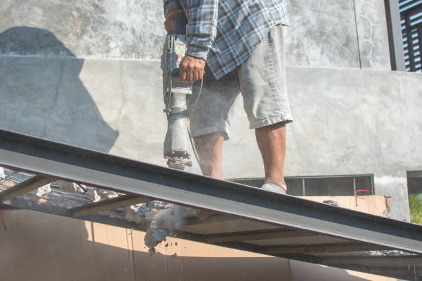 istock The construction worker is drilling the floor. Construction technicians use electric hammer chisels to destroy the floor 1480522013