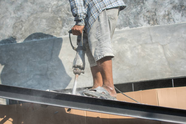 istock The construction worker is drilling the floor. Construction technicians use electric hammer chisels to destroy the floor 1480522018