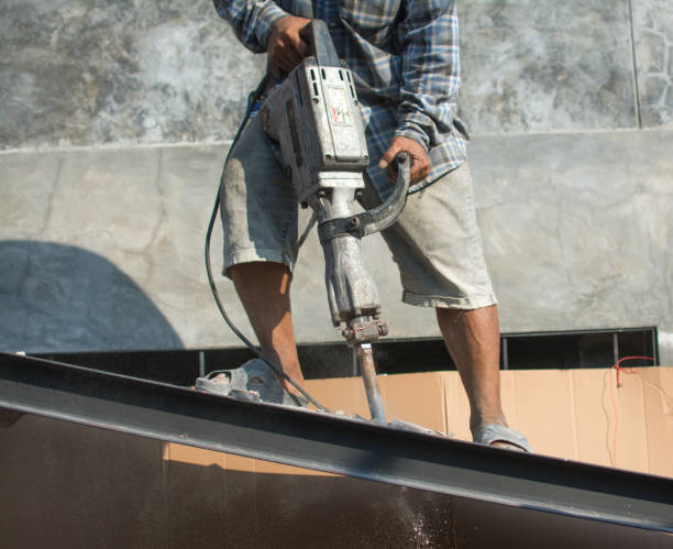 istock The construction worker is drilling the floor. Construction technicians use electric hammer chisels to destroy the floor 1480522047
