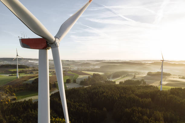 istock Wind turbines with low angle sunrise backlight seen from an aerial view 1480523565
