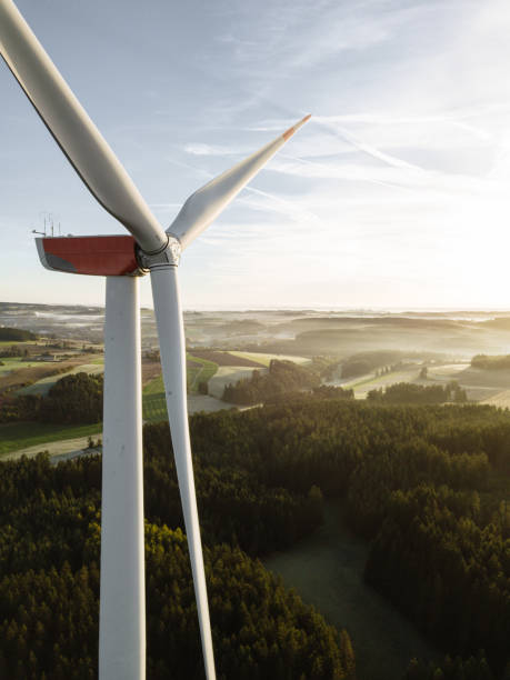 istock Wind turbines with low angle sunrise backlight seen from an aerial view 1480523567