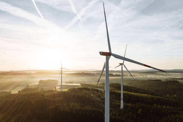 istock Wind turbines with low angle sunrise backlight seen from an aerial view 1480523605