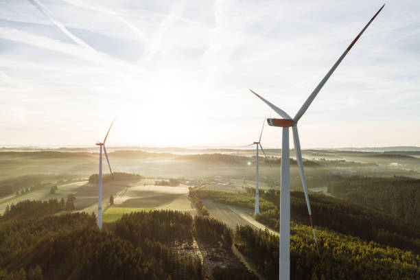 istock Wind turbines with low angle sunrise backlight seen from an aerial view 1480523611