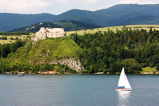 Medieval castle and sailboat. Czorsztyn Castle, Poland.