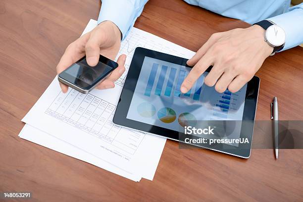 Man Working With Modern Devices Stock Photo - Download Image Now - Adult, Adults Only, Analyzing