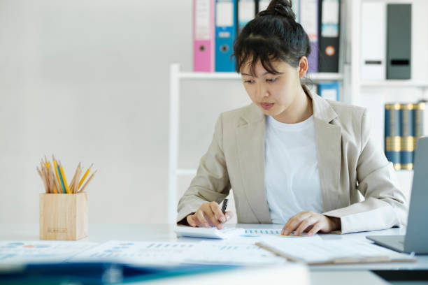 istock Accountant is working on her desk by using her calculator. 1480535693