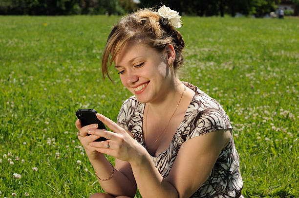 Young woman with mobile phone stock photo