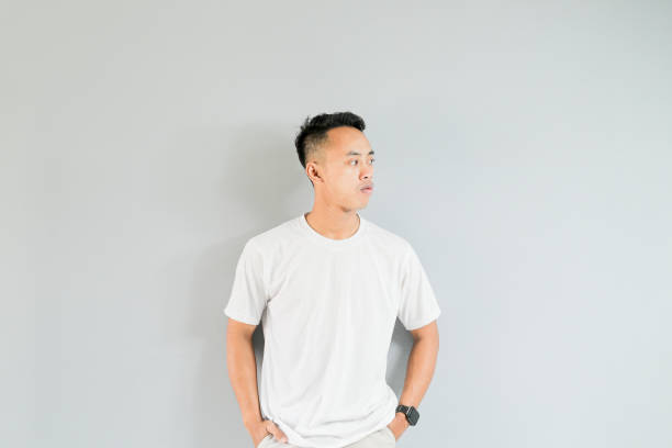 istock a young asian man is showing thinking gestures 1480545244