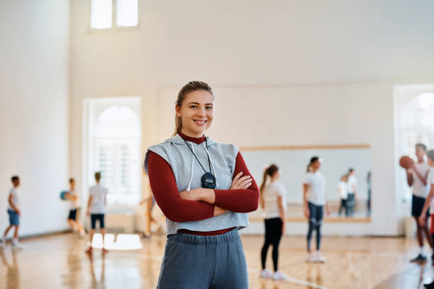 istock Young confident sports teacher during physical activity class at school gym looking at camera. 1480547021