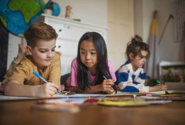 istock Happy friends drawing together in a room. 1480547095