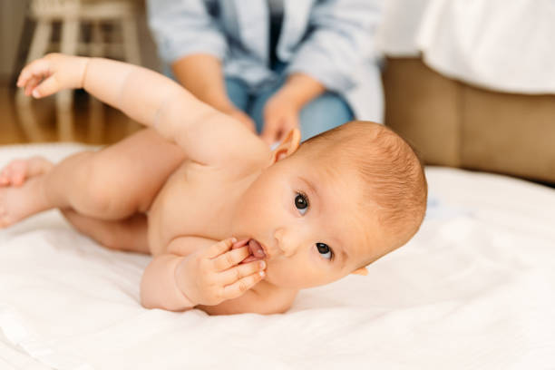 istock Mother changing diaper to her baby 1480547098
