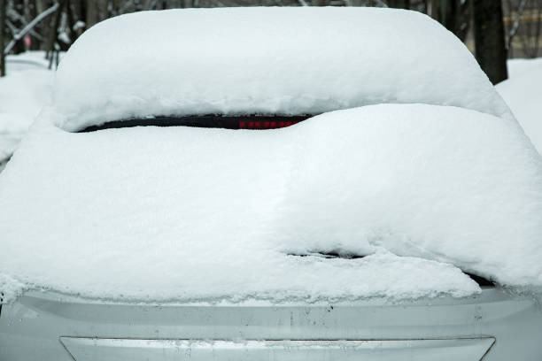 istock rear window with windshield wiper, washer and brake light covered with a large layer of snow on a winter cold day. 1480547287