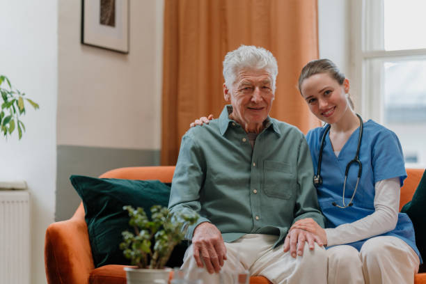 istock Young nurse checking elderly senior in his home. 1480547510