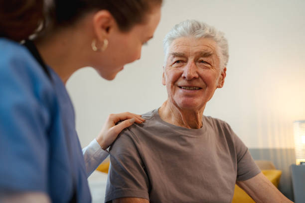 istock Young nurse checking elderly senior in his home. 1480547606