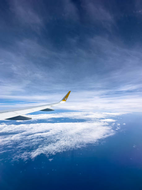 Wing of Pegasus Airlines/flypgs Wing of Pegasus Airlines/flypgs above the clouds taken from the window during the flight from Cyprus to Turkey on 04/02/2023 airbus a320 stock pictures, royalty-free photos & images