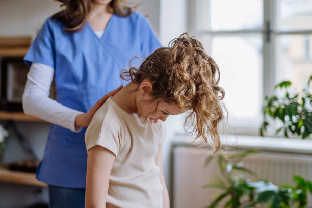 istock Little girl doing exercise with a nurse. 1480549756