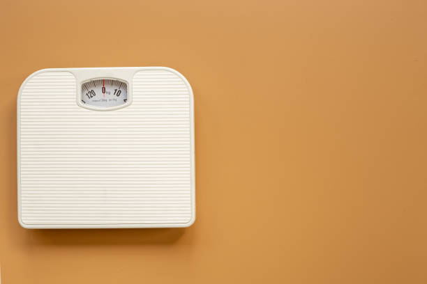 istock Check your body shape with white weight scales, top view 1480549770
