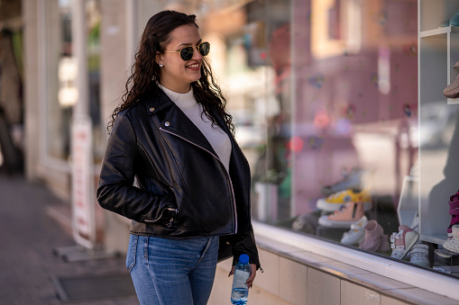 Girl model walking down the street