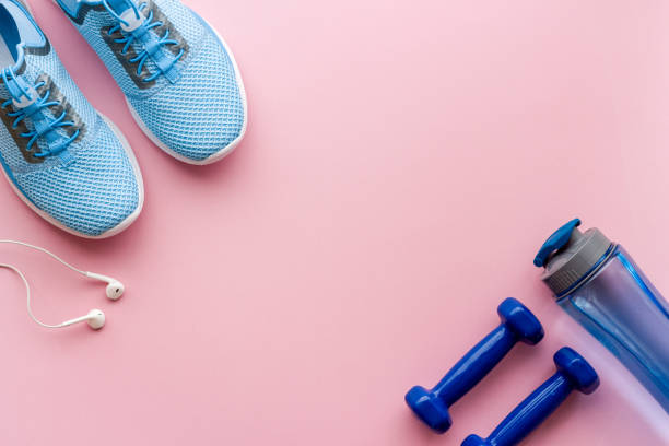istock Athletics set with sneakers and dumbbells, top view 1480550840