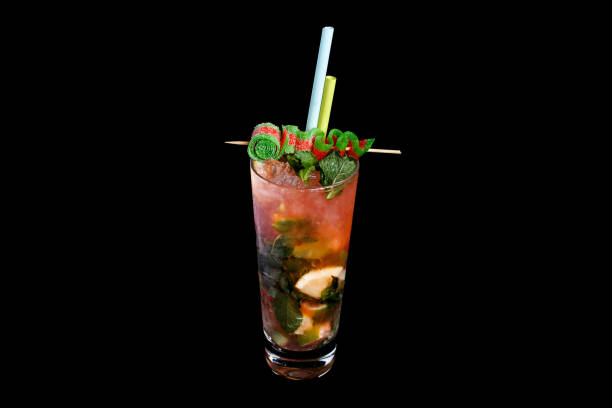 istock Alcoholic cocktail on a black background, decorated with a skewer with berries and straws. 1480554121
