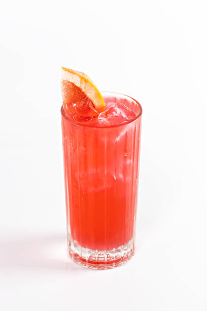 istock Red cocktail in a deep glass decorated with grapefruit and ice. 1480554811