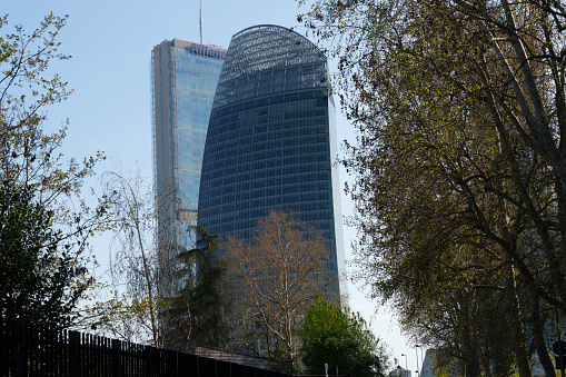 Milan, Italy - March 29, 2023: Citylife, modern park in Milan, Lombardy, Italy, with the Three Towers