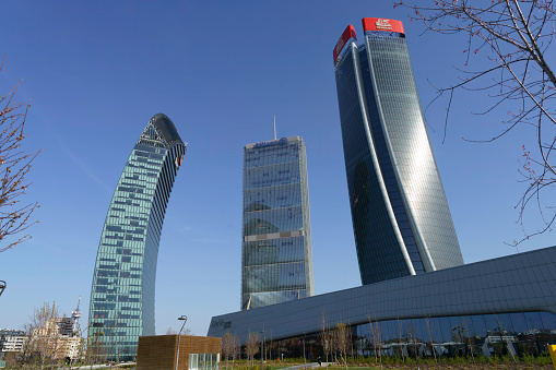 Milan, Italy - March 29, 2023: Citylife, modern park in Milan, Lombardy, Italy, with the Three Towers