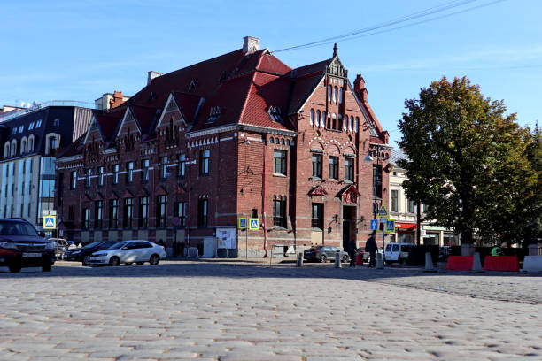 Cityscape with old stone houses and stone pavement in downtown. Vyborg, Russia - August 19, 2022.