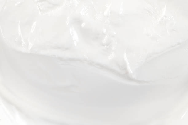 istock Close-up of white cosmetic cream surface as texture or background, top view 1480557321