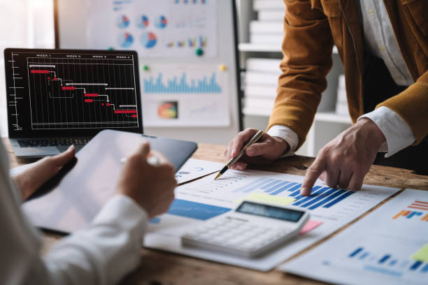 istock Finance manager meeting discussing company growth project success financial statistics at home office. 1480558192