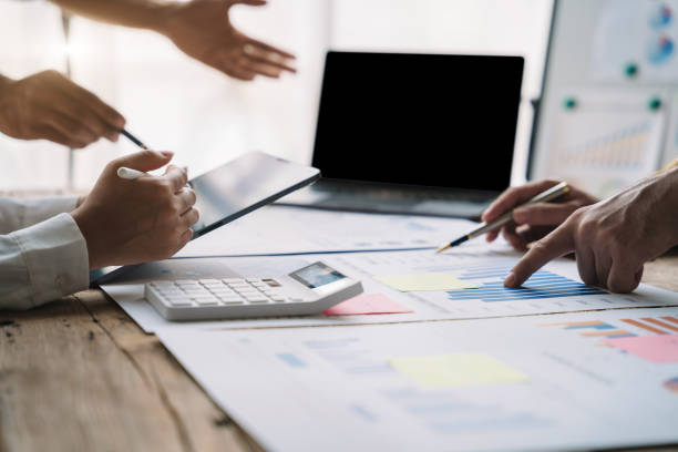 istock Finance manager meeting discussing company growth project success financial statistics at home office. 1480558200