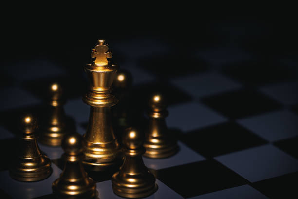 istock Leadership gold king chess piece surround by pawn. 1480559209